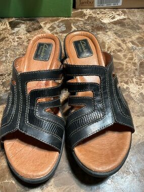 Clarks Black Leather Cutout Slide Sandals with Tan Footbed